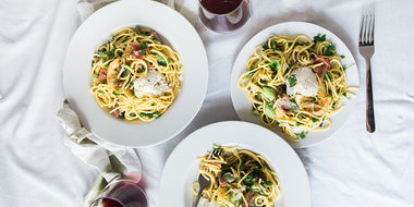 Pasta dishes with wine glasses