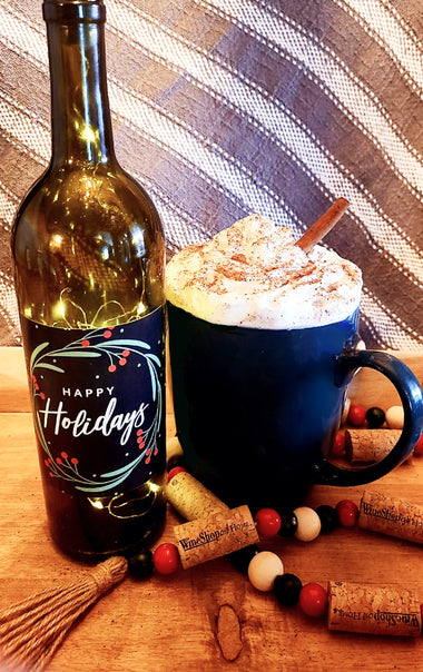 Christmas Morning Cheer cocktail - "Happy Holidays" wine bottle with lights inside, a coffe mug filled with whipped cream