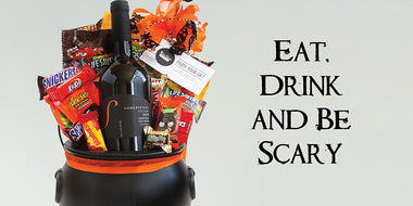 Halloween cauldron gift with wine and candy