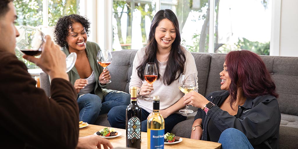 Women of various nationalities enjoying some WineShop At Home wine