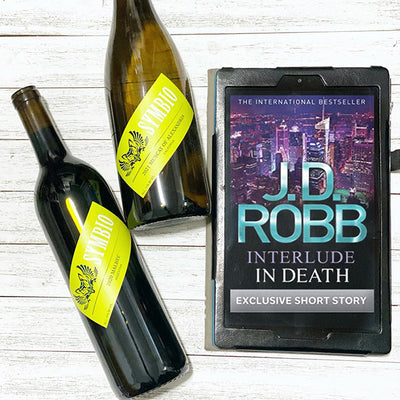 A bottle of Symbio 2020 Muscat of Alexandria and 2020 Malbec next to a digital copy of "Interlude In Death"