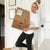 Woman holding box of WineShop At Home wines