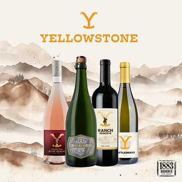 Four bottles of Yellowstone wine with a mountainous landscape background