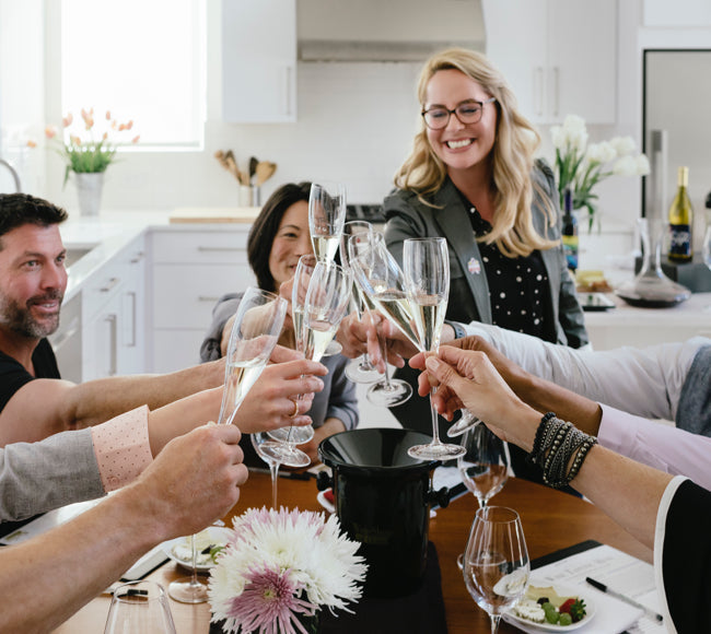 Group of friends at a Wine Tasting cheersing with sparkling wine