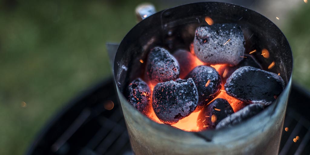 Why Do Grilled Foods and Wine Pair Well Together? Charcoal chimney on grill