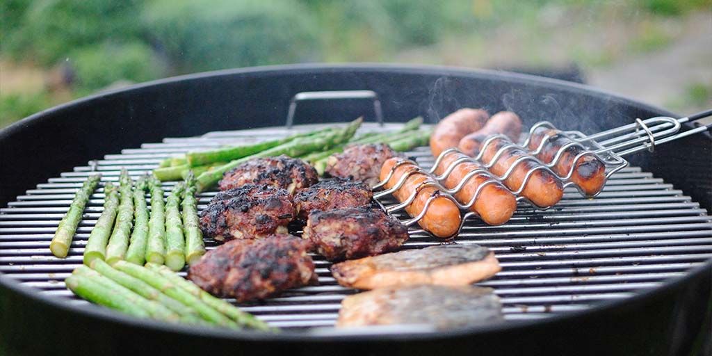 Why Do Grilled Foods and Wine Pair Well Together? Different kinds of food being grilled