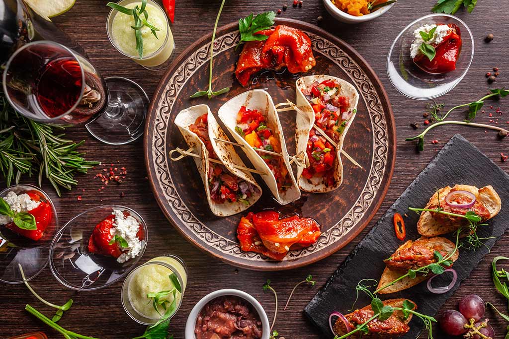 Crowd-Pleasing Tasting Themes - Mexican tacos, taco fixings and red wine