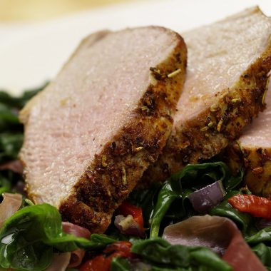 Rosemary Pork Tenderloin on a Bed of Spinach, Roasted Red Peppers and Prosciutto