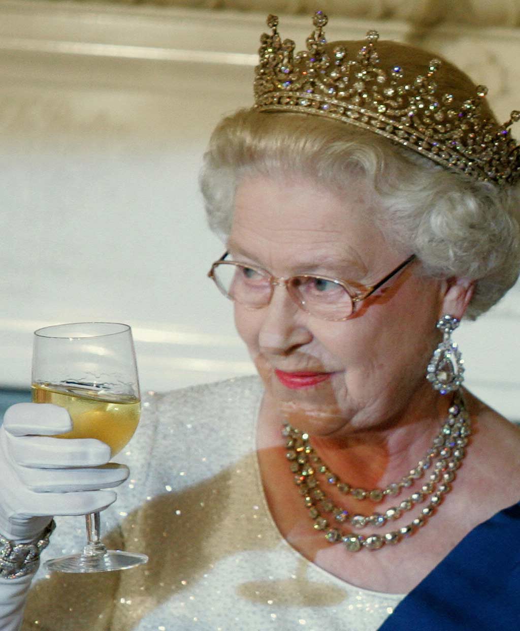 Queen Elizabeth cheering with a glass of wine
