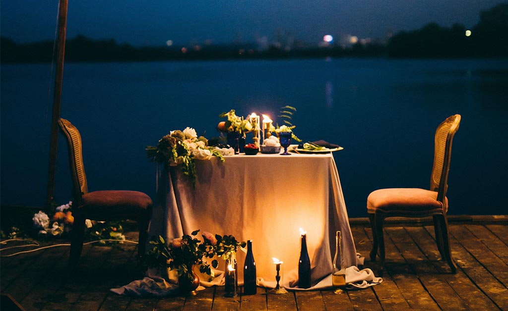 Romantic dinner on a deck on a summer night