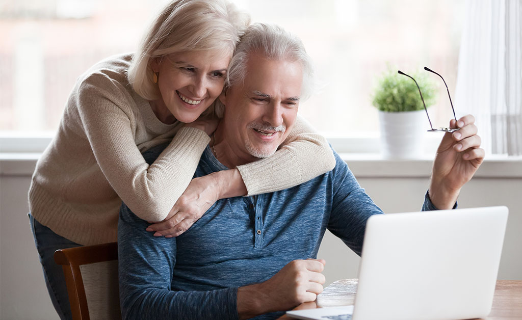 Senior citizen couple on computer