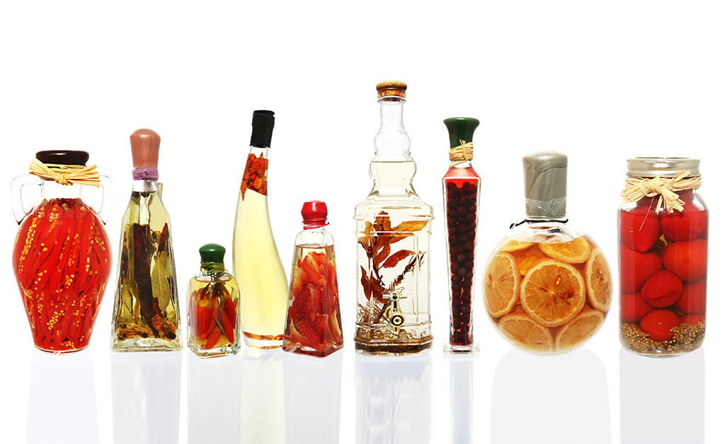 Variety of oil infusioned preserved fruits and vegetables