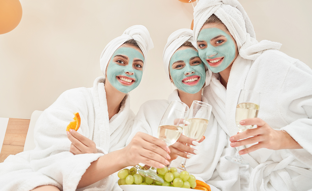 Women enjoying wine during a spa day